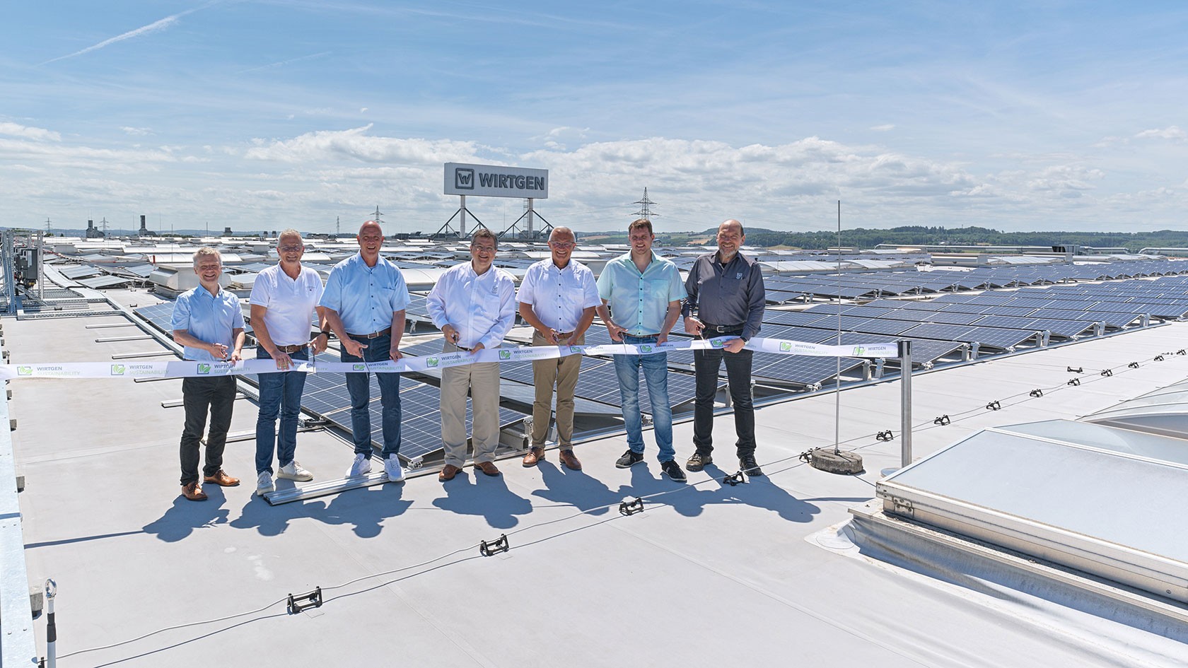 Cutting the tape at the inauguration of the rooftop photovoltaic system at Wirtgen GmbH