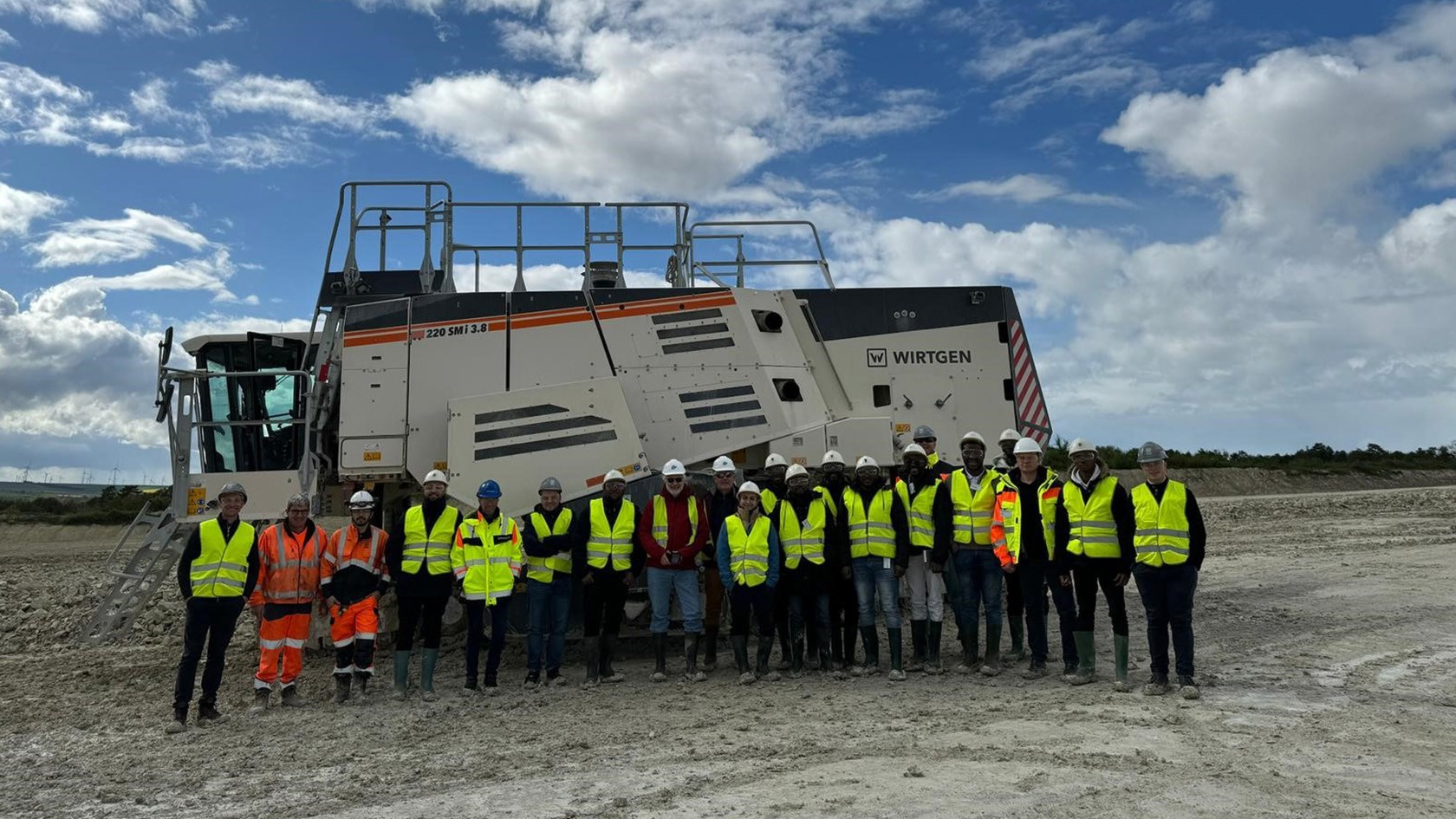 Group portrait in front of a Surface Miner